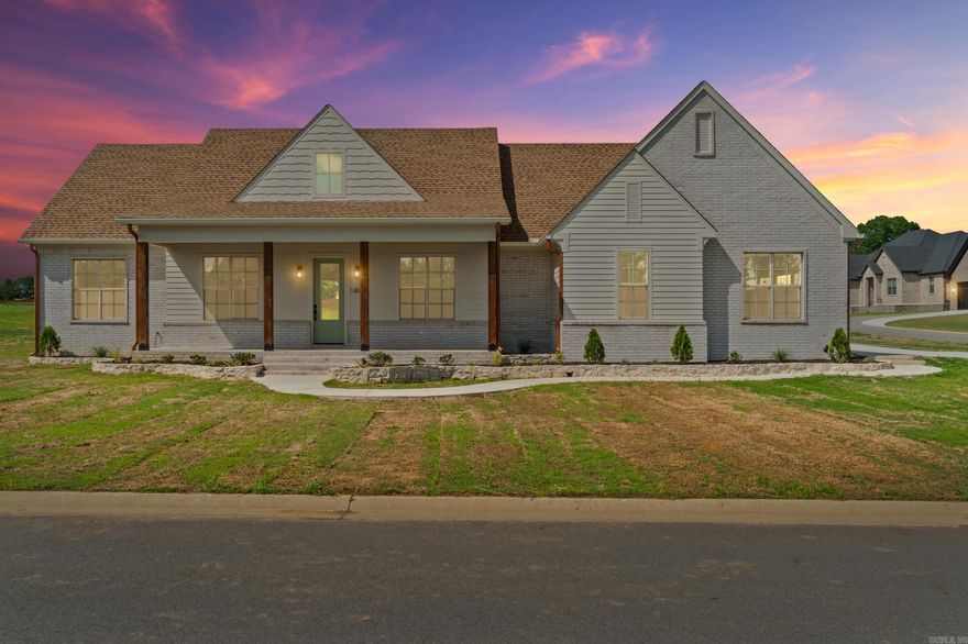 Beautiful new construction home in Belmont Estates with thoughtful design and high end features.  This home features four spacious bedrooms, two and a half baths and offers soaring ceilings, lots of light, and a fabulous brick fireplace as the focal point of the open living area. The kitchen is designed with a large island, breakfast bar seating and a Pinterest worthy hidden pantry.  A separate dining room or office provides flexible space.  Lockers, a spacious laundry room with added storage and an elegant half bath add charm to the back entry off the garage.  The back porch is spacious and features a charming wood ceiling.