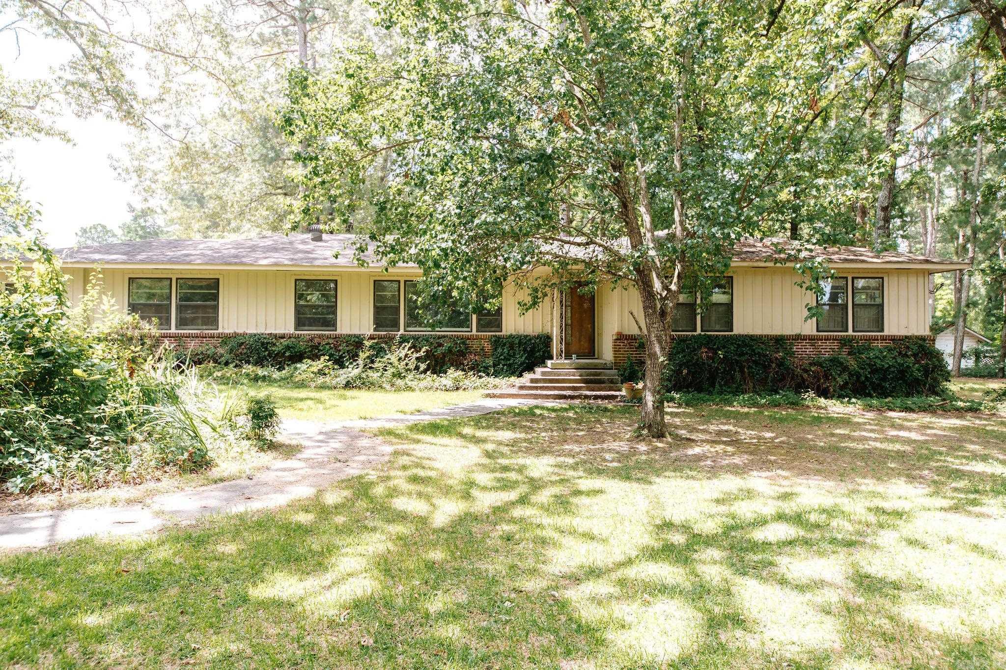 Spacious and well-maintained 4 bedroom, 2bath home nestled on a beautiful 0.79 acre shaded corner lot. With 2,464 sq ft of living space, this home offers comfort, functionality, and room to grow. There is a generous floor plan featuring a large kitchen, with ample cabinetry, and plenty of natural light throughout. 350 sq ft building for guest house, or storage. Call today to make this yours.