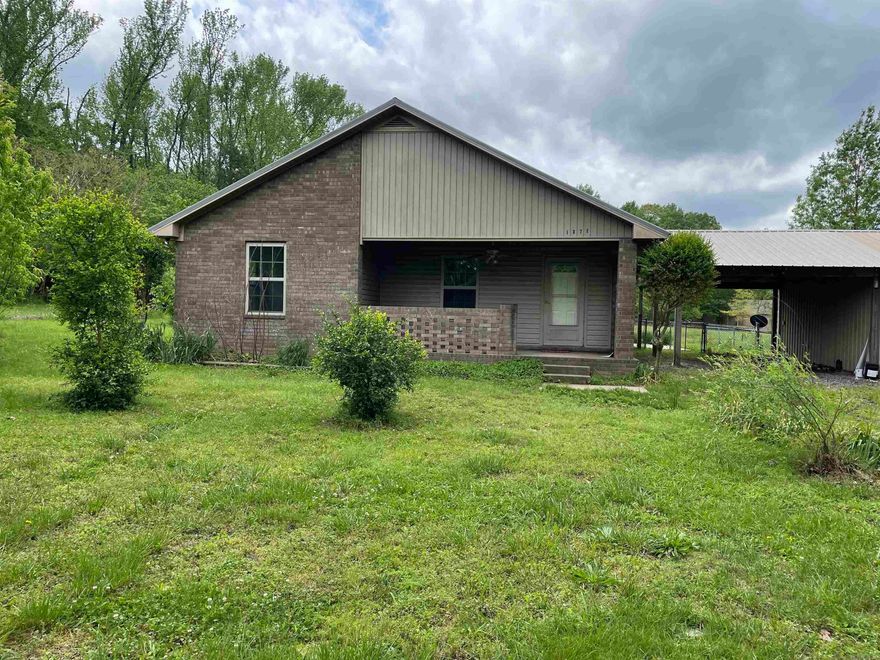 Take a look at this 2 bed 2 bath home on Approx. 1\2 acre.  There are peach trees, apple trees, fig trees and Citrus trees, (That produce lemons)   This home has new paint, new flooring, new hot water heater, dishwasher and microwave.  There is a carport with shop attached.  No property disclosure.  Seller has not lived in home.