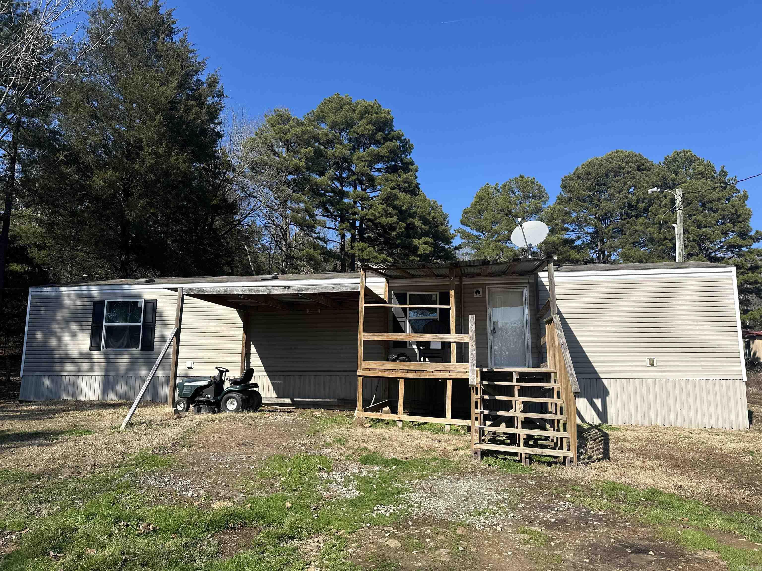 Escape to the simple country life in this cozy mobile home, just .3 of a mile to the Ramsey Access of the Little Red River. Enjoy the peaceful rhythm of fishing for rainbow trout, far from the noise of the world. This home is very clean and has been well cared for. The perfect blend of comfort and convenience with a practical space for a few guests or a small family.