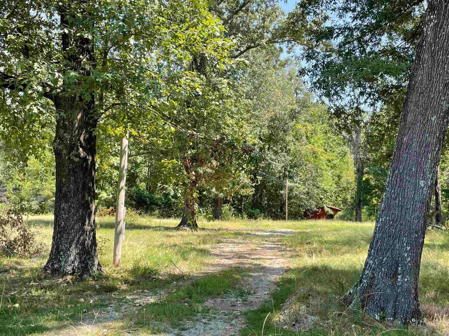 This 4+- acres was a residential lot that has some utilities available.  This property is outside the city limits so mobile home is acceptable.