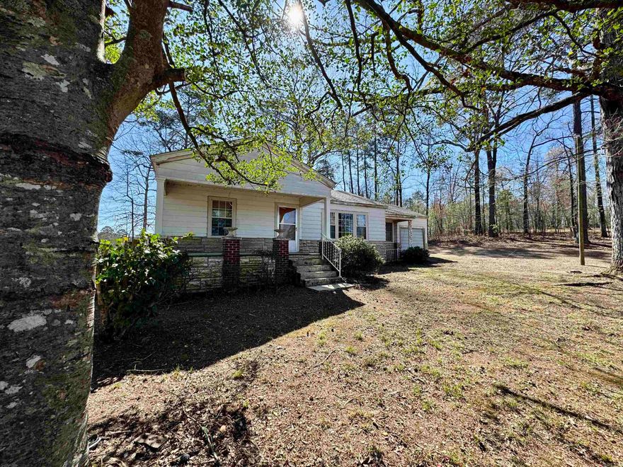 Looking for the affordable home outside of town?  Here it is.  This property has a 3 bedroom 1 bath home with 20 x 28 shop building with additional electric for large machinery.  Home offers original hardwood floors, LARGE front porch, very clean storm cellar.  This property has room and within 10 minutes of town.   Agents see Agent Remarks for Legal