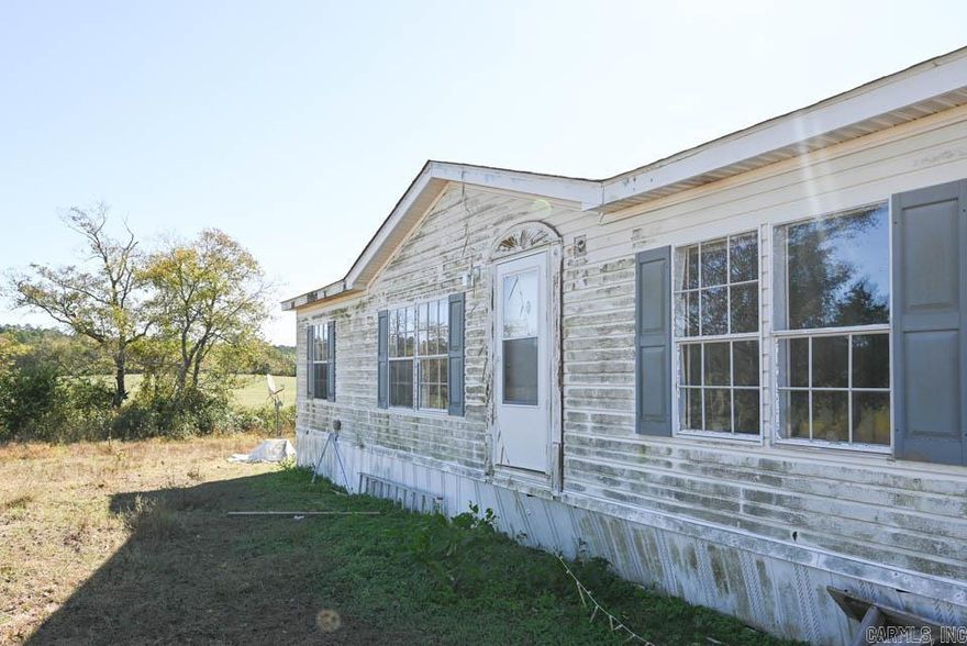Mobile home sitting on 2.5 acres atop a small hill.  Beautiful setting.