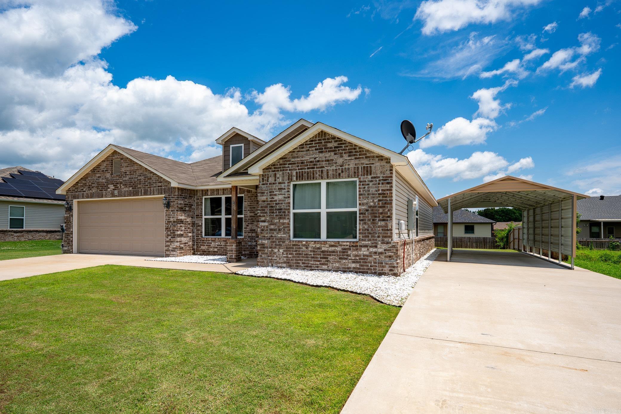 Come check out this Spacious 4-bedroom 2-bath home featuring an open, split floor plan with luxury vinyl throughout! They have added an additional driveway with carport in addition to the driveway for garage for extra parking! It also features low maintenance landscaping with clean white rock accents! Wouldn't take much to fully fence or to add gas as it is at the house!