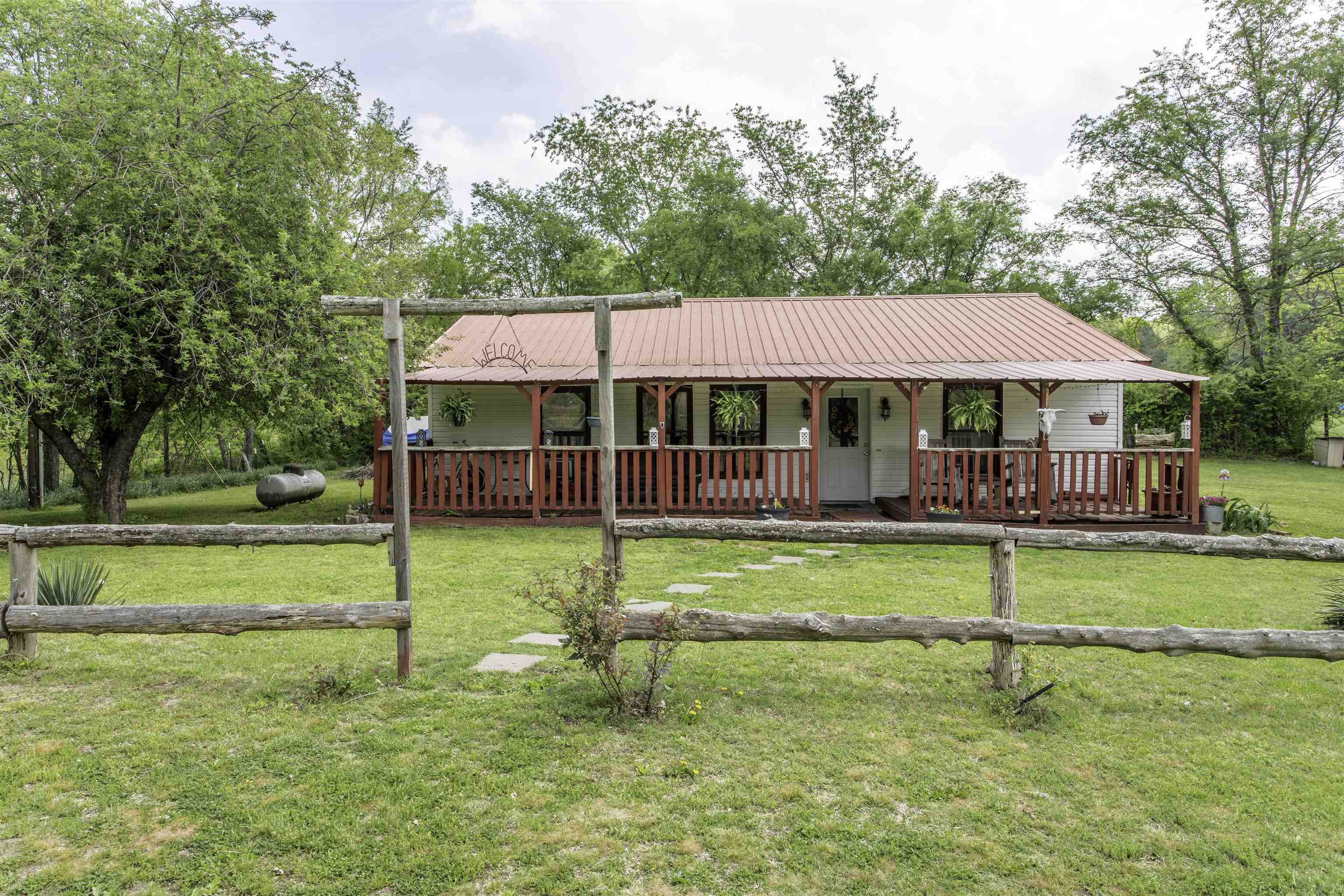 Welcome to the Market 223 Hwy 395 N in Salem, AR. The interior features 1,200 sf of well laid out living space. This 2 bedroom, 1 bath home sits on .63 +/- acre and is partially fenced. This home features an open living space with a living room, kitchen and dining room. The dining room can be converted into a 3rd bedroom. This home features 2 outbuildings to hold your tools, lawn mower, and garden supplies. There is a pear, peach and apple tree on the property. Call today to make this house your home!!