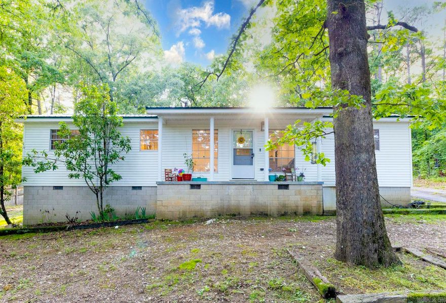 This home makes you feel like you're country living, yet keeps you close to town. Close to I-30 sits this 0.90 acre, updated home. Updates include: 10 x 16 shop (to convey). New electrical throughout. New insulation, new paint / sheetrock. French doors. New plumbing in sunroom and kitchen. Completely remodeled bathroom. New HVAC & water pump 2021. This home also offers a metal roof, hardwood floors, sunroom and so much more!