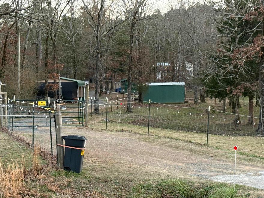 Where else can you saddle up or hit the trail right from your back door and be in miles of National Forest in minutes? This charming horse property, thoughtfully decorated home borders the NATIONAL FOREST and is packed with impressive upgrades.  Recent updates include a brand-new metal roof (June 2024), new carport with its own power and meter (perfect for an RV hookup), a new water heater (April 2024), and fresh interior paint (2024). You’ll also love the solar panel system (2023), which has kept summer electric bills very inexpensive (Solar panels are paid off), plus new Whirlpool appliances (2022) and a new well (2022).  Inside, enjoy new vinyl flooring throughout, and the indoor and exterior A/C units are equipped with smart thermostats for comfort and efficiency. Outside, most of the land is fenced, with a gated entrance, making it ideal for animals, privacy, and peace of mind.  A dream setup for homesteaders, hunters, horse lovers, and anyone who wants true “backyard access” to the outdoors.