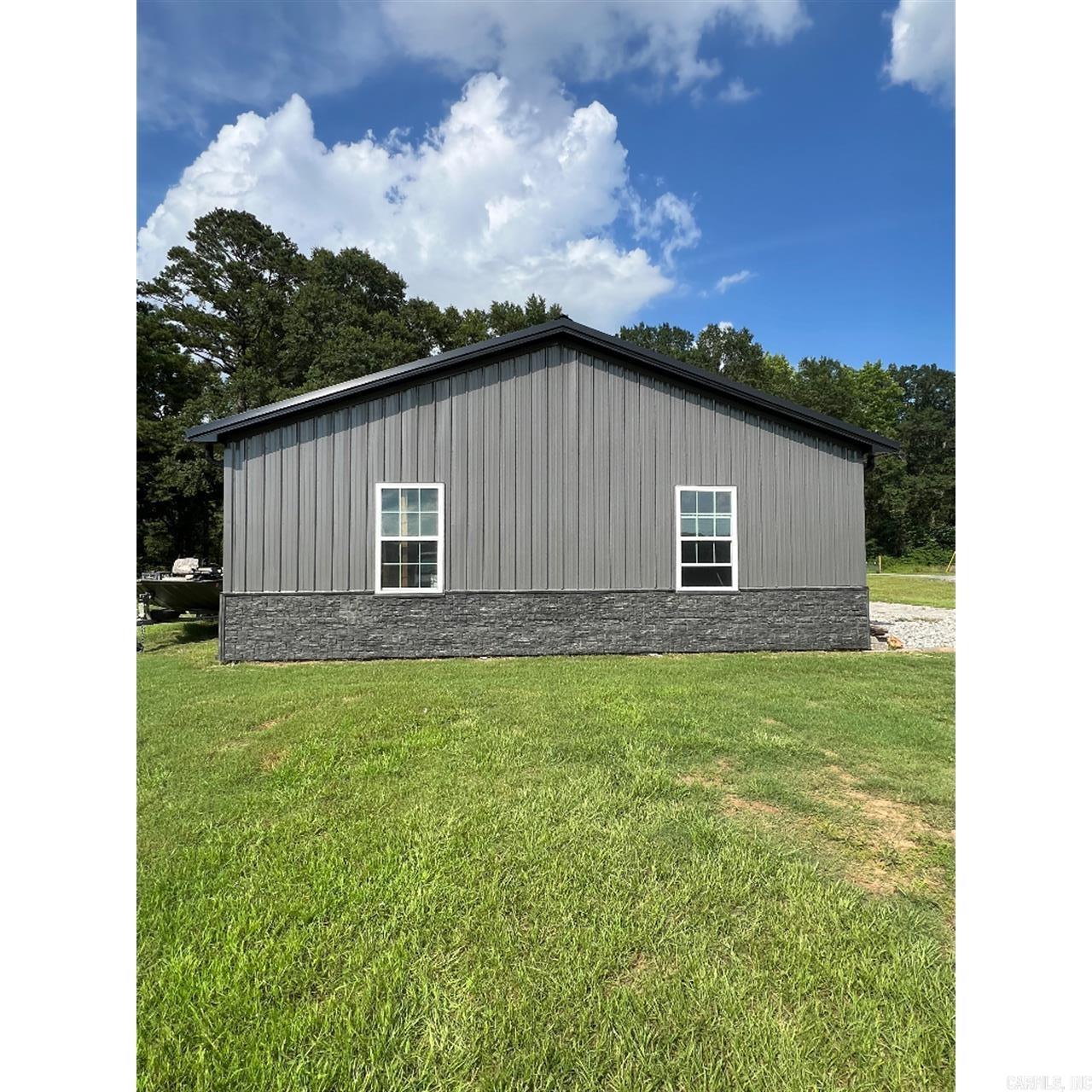 This 1.36 acre property on the Little Red River near Ramsey Landing has 206 ft of easily accessed river frontage. The house is 1 bed/1bath with an additional sleeping loft, separate laundry room, and an outdoor shower. All appliances are less than 2 years old and will convey. Make the living quarters your permanent home or use it temporarily while building a house overlooking the water. In addition to the living quarters, the adjacent shop/garage has 1000sq ft of very nice work/storage space.