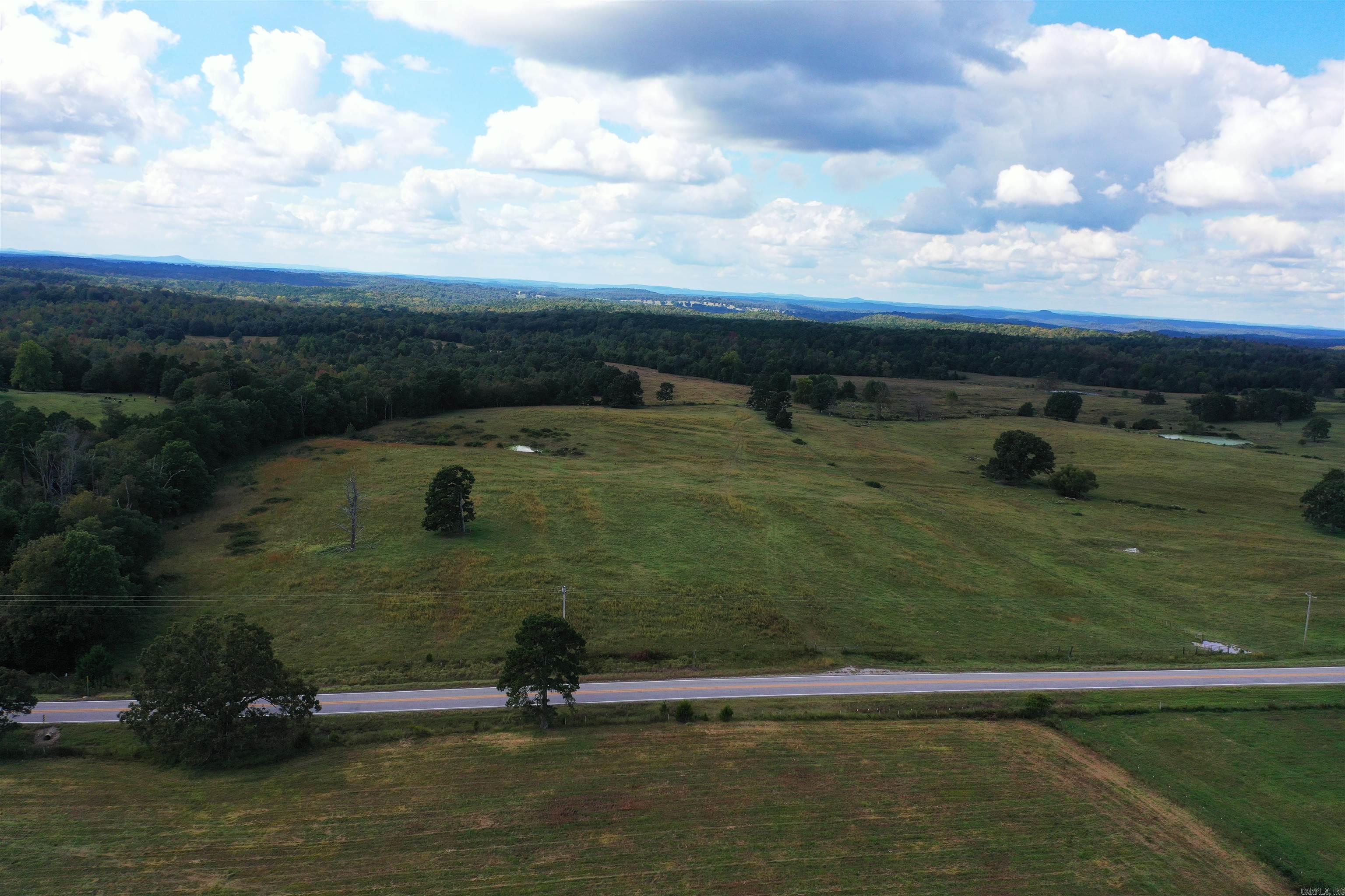 Check out the perfect blend of natural beauty, resource potential, and versatile land? Look no further! This exceptional property offers everything you need: 135 acres with 35 acres in permanent pasture. State highway and county road frontage, this land teeming with wildlife that provide hunting opportunities and habitat for whitetail deer, turkey, bear, and many other wild game species! The acreage is well suited for off-roading, hiking, camping, and horseback riding. There are many beautiful locations to build your dream home with ample privacy. Property has a valuable gravel resource ready for extraction, offering an additional income stream. Spring and wet weather creek run through the property. Fence on 3 sides of the property. Water and electricity available. Additional land can be purchased that joins the property. Agent owned.