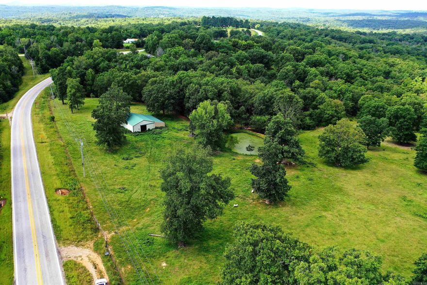 12.9 acres AND huge 40 x 30 barn AND pond AND spring fed creek!  This property has everything for a mini farm!  Fantastic barn with electric,  sliding doors on both ends, stalls, lean to for hay, and tack/feed room.  Pond is around 40 feet across.  Completely fenced!  Beautiful area!  Come walk the land and you won’t want to leave! Perk being revalidated.