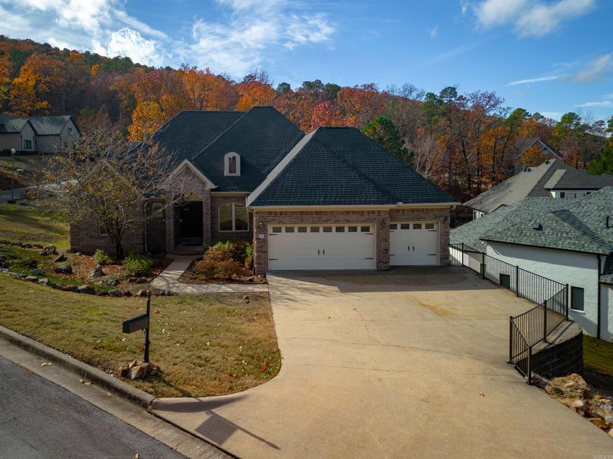 Discover elegance in this 2,326 sq ft, 4-bed, 3-bath home in the prestigious "Chenal Valley Challain Place." Luxuriate in three community pools for just $49/month. The residence boasts an office, 10' and 12' ceilings, a living room, formal dining, family room with a fireplace, and a breakfast bar. The master suite includes a lavish bath, walk-in closet, and access to a sunroom and backyard decking. Enjoy the covered trilevel deck with natural views. Recent upgrades, including a new roof, double sink, dual oven, and dishwasher, enhance the appeal. The refrigerator is included. Experience elegant topography surrounded by custom homes in a meticulously maintained neighborhood.