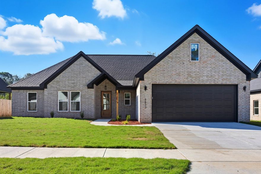 Check out this brand new, modern 4-bed, 2-bath home with 2,070 SF and a true split floor plan. The light-filled living room features custom wall trim, a sleek electric fireplace with wood mantle, and wide-plank LVP flooring that carries through the main areas. The open kitchen showcases custom cabinetry, a large island, quartz countertops, subway tile in a herringbone pattern, under-cabinet lighting, and a gas range under a designer hood. The private primary suite offers a spa-style bath with a freestanding soaking tub, tiled walk-in shower, and a huge walk-in closet with built-ins. Three secondary bedrooms sit on the opposite side of the home for privacy. Thoughtful extras include a mudroom drop zone, tall ceilings, black hardware/fixtures, and abundant storage. Enjoy the covered back patio overlooking a tree-lined backyard. New construction convenience in one of Bryant’s newest subdivisions—move-in ready and sharp.