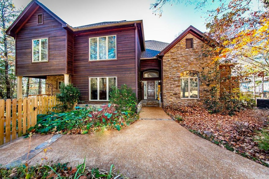 ACREAGE with a well built Lakefront Home, Approx. 500sqft +/- Bonus room above garage, AND a Boat Slip are hard to find.  Take a look at this property that includes approx. 8.33 acres, path to the water's edge and a short SXS ride to the Streib Community Dock which includes One Boat Slip off of Cherokee Drive. Bonus Room above garage just completed this year (2023) which can be used as game room/bunk room/media room/etc. New Architectural Shingles on home & detached garage in 2023, New Hot Tub, new kitchen appliances (double oven, microwave, dishwasher, cooktop w/downdraft, trash compactor, & ice maker). At the shoreline, you have a beautiful view of Sugarloaf Island. A slice of paradise as your property starts at Grand Isle Drive & winds through your acreage as your travel down Tall Pines to your driveway.  Three car garage which includes a saferoom on main level & the bonus room above