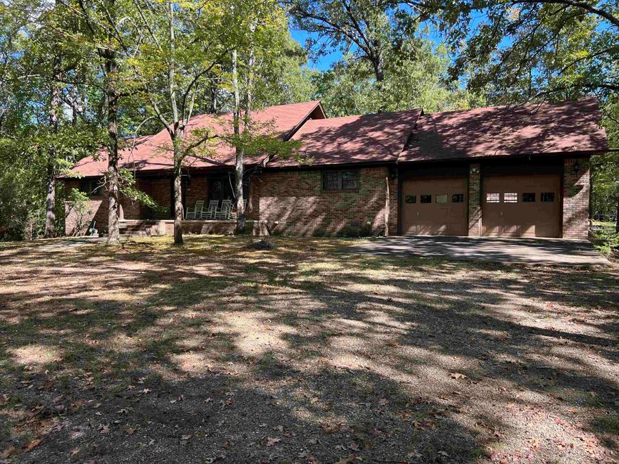 Looking for the perfect get away?  This beautiful 2 bed 2 bath brick home on 2.4 acres is awaiting you! This home includes a 30x48 shop with two rollup doors and a section that could be converted into an apartment, a 10x12 utility building, asphalt drive way, two spacious bedrooms, an eat in kitchen with a beautiful view, spacious living room with wood burning fire place, large laundry room with plenty of storage, and built in cabinets in garage. This home is located within 2 miles of Denby road, .2 miles of Mtn Harbor road, .7 miles of Tompkins bed, approximately 10 miles from Mt. Ida and 26 miles to Hot Springs.  The Vista Trail runs behind the property which provides a great opportunity for hiking and mountain bike riding.