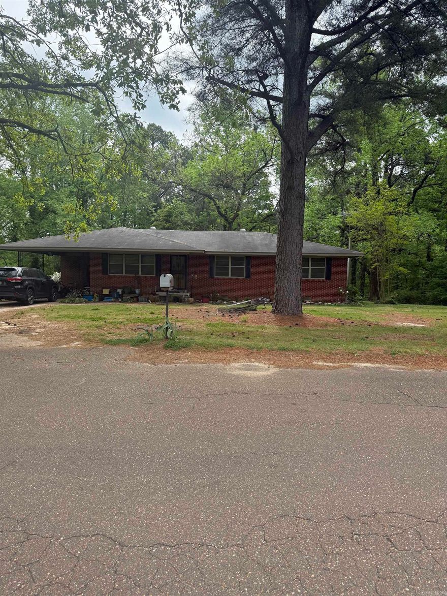 What a great neighborhood to raise a family in!  Located on beautiful Crowley's Ridge, this quiet street is ready for you to come home to.  This is a great home for the first time homebuyers or anyone looking to downsize.  With 1.5 acres, there is a spacious backyard with large trees and plenty of room for enjoying the outdoors.  There is a 12 x 15 storage shed and a 14 x 16 pole barn located at the back of the property.  The home also features a very spacious utility room.  There is a large den that can be used as formal dining room, office, or theater room. There is an underground propane tank that supplies an alternate heat source and wall mounted lantern in case of power outages.  This is a well-built home waiting for you to take a look!