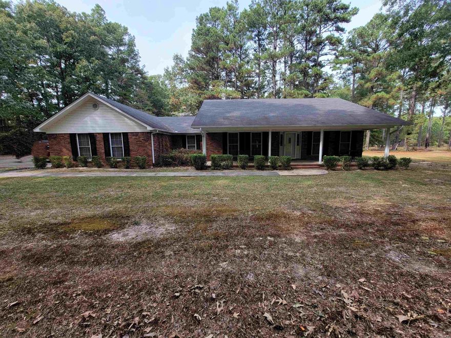 Extremely well maintained one owner home located on 8 acres. There is a 30X50 metal shop on a slab with a front office area that includes a full bathroom. Roof installed in 2020. Some pasture are already cleared for livestock! Oversized laundry room. Large walk in closets in each bedroom. Lots of extra storage throughout the home.