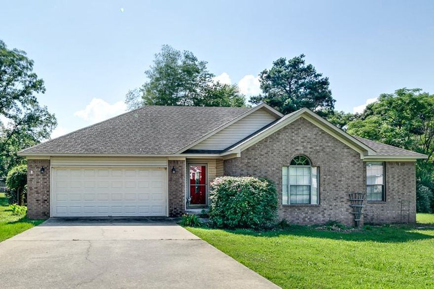 Great layout with super nice yard.  Elegant entrance leads to large living area with hardwood floors.  Kitchen has tons of counter space, cabinets and refrigerator too!  Large master bedroom and bathroom with double vanities AND a huge walk in closet.  You'll love the spacious spare bedrooms too!  Oversized backyard features nice tiered deck...perfect for entertaining!  Refrigerator, washer and dryer stay! New Heat/Air in 2012. Seller will install new carpet in bedrooms with acceptable offer (up to $1600).