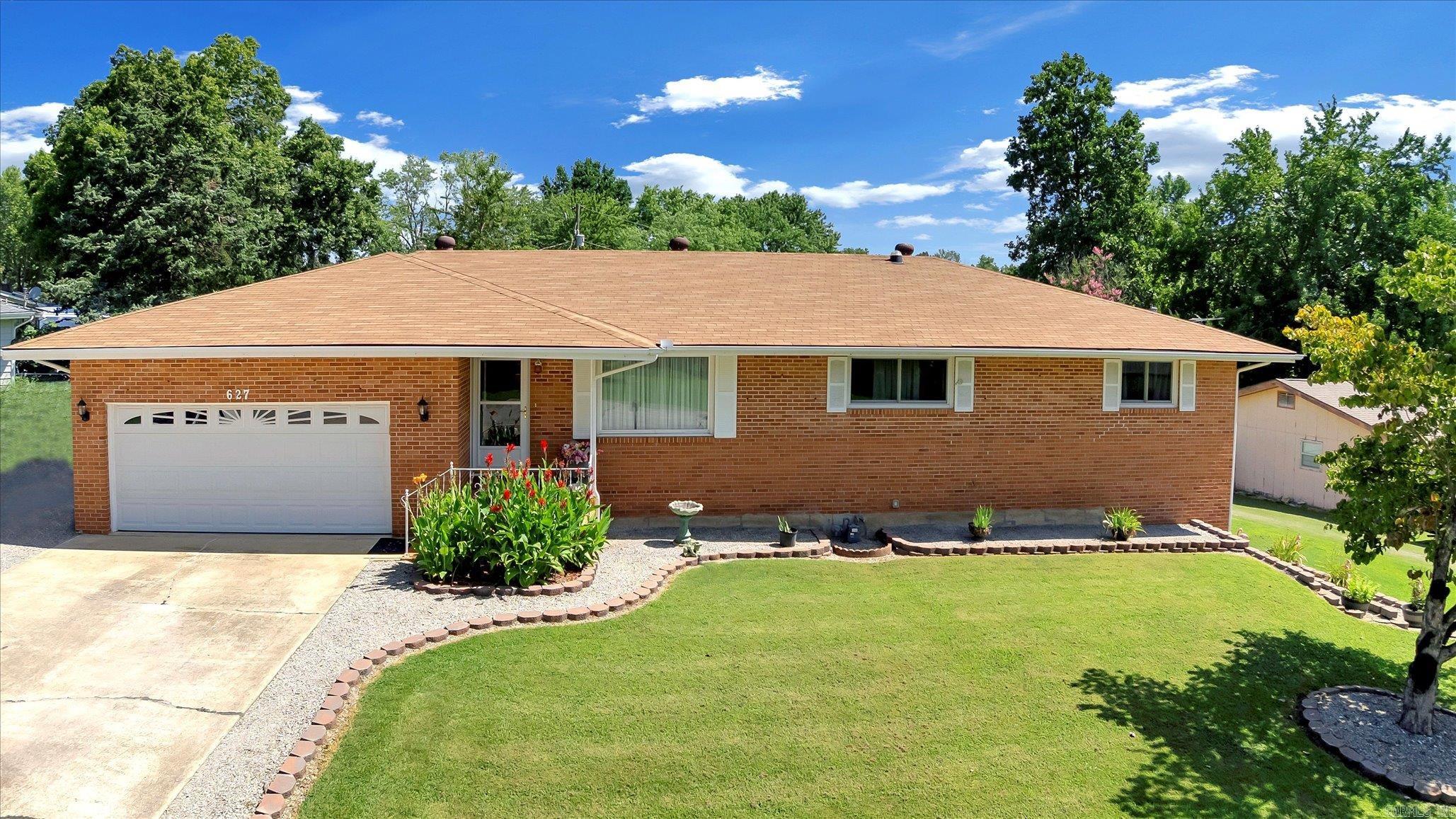 TONS OF SPACE in this beautifully updated all-brick 3-bedroom, 2.5-bath residence nestled in a quiet subdivision on a .32-acre corner lot. Boasting a heated and cooled sunroom, full basement, workshop, storage and a secure storm room, this home offers comfort and peace of mind. The expansive 2-car garage is complemented by an additional garage stall on the lower level. Enjoy the brand-new 10x16 storage shed. Inside, enjoy all-new 2023 high-end appliances, HVAC, ductwork, electrical, and new bedroom windows. Fresh professional landscaping enhances the elegant curb appeal. Abundant storage throughout. Conveniently located near the hospital and medical facilities, this exceptional home is the perfect blend of charming style, and functionality. Buyer to verify all measurements and square footage.