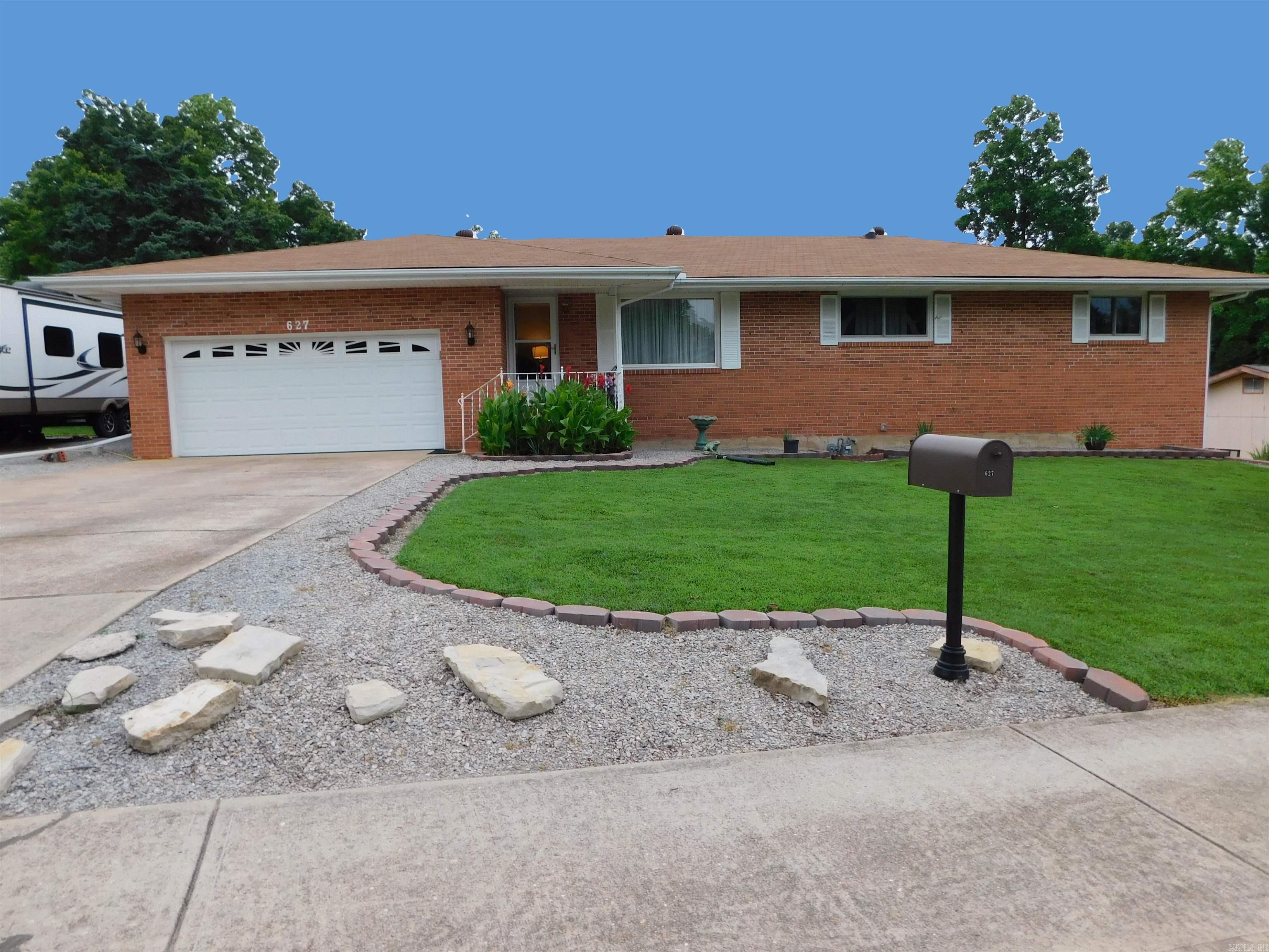 TONS OF SPACE in this beautifully updated all-brick 3-bedroom, 2.5-bath residence nestled in a quiet subdivision on a .32-acre corner lot. Boasting a heated and cooled sunroom, full basement, workshop, storage and a secure storm room, this home offers comfort and peace of mind. The expansive 2-car garage is complemented by an additional garage stall on the lower level. Enjoy the brand-new 10x16 storage shed. Inside, enjoy all-new 2023 high-end appliances, HVAC, ductwork, electrical, and new bedroom windows. Fresh professional landscaping enhances the elegant curb appeal. Abundant storage throughout. Conveniently located near the hospital and medical facilities, this exceptional home is the perfect blend of charming style, and functionality. Buyer to verify all measurements and square footage.