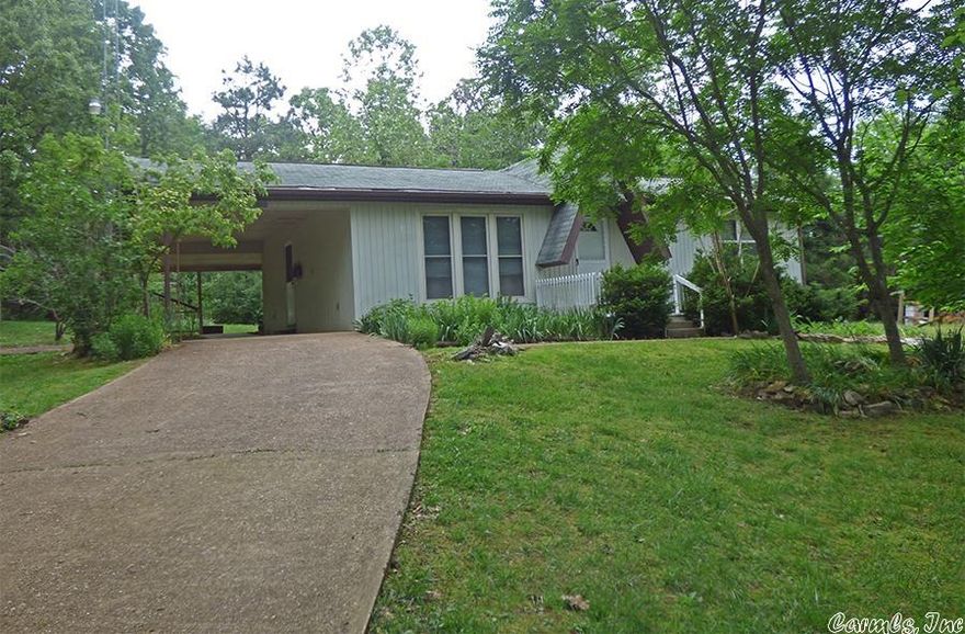 Private Location - Corner Lot - The  home has an open living room / kitchen floor plan. There are two (2) bedrooms, a full bath, and a good size utility room. Covered back patio, carport storage and detached storage building. Plus a garden spot. This Horseshoe Bend home is situated on a nice corner lot with privacy. It's priced to sell!