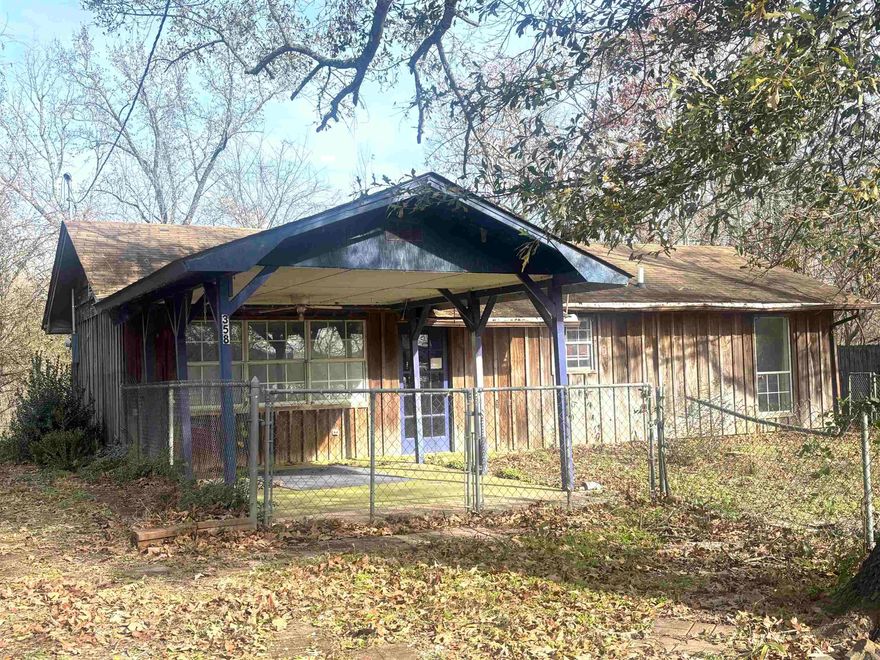 Welcome to this home that has views of Harris Brake Lake out front and has 2 lots. Home features 2 beds and 1 bath with an open floor plan.  Nice wood stove, sun room, cypress siding and screened in porch.  Home has window unit and is all Elec with septic.  Partially chain link fenced front yard.  Nice potting shed with lein-to.  Covered area in front yard to see those beautiful lake views. Home being sold as is condition. AGENTS see remarks!!