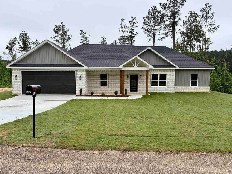 This new construction all electric home offers approximately 1650 square feet of comfortable living space in a country subdivision on a little over 3 acres.  Featuring an attractive brick and vinyl exterior, this property offers the perfect blend of privacy, space and modern comfort.  Step inside to a spacious, open den/kitchen designed for gathering, complete with gorgeous quartz countertops, a large island with matching quartz surface, and plenty of room to cook, entertain and enjoy everyday living.  Storage is abundant throughout the home, with built-in features in all closets to help keep everything organized.  The oversized primary suite provides a relaxing retreat with a spacious bedroom, large bathroom featuring a soaking tub, walk-in shower, and generous walk-in closet.  The laundry room offers exceptional storage with two closets and laundry sink.  Enjoy peaceful morning and relaxing evenings on the covered back patio overlooking your acreage.  If you are looking for country charm with modern features and room to spread out, this one is a must-see.  (Taxes are based on lot price - not house.)