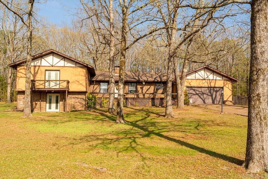 Enjoy privacy and space with this split-level home on just under 3 wooded acres in a quiet neighborhood near Greers Ferry Lake. Featuring 3 bedrooms, 2.5 baths, and a versatile bonus basement with ground-level walkout, this home offers flexible living options. Inside, you’ll find an inviting layout with a gas log fireplace, large living area and laundry room, and open-concept kitchen with breakfast bar and dining area. Ample storage is found throughout. Outside, the property includes a screened in back porch, garden area, partial chain-link fencing for pets, and plenty of room for outdoor activities. A  large heated shop building adds valuable workspace or storage. Additional highlights include ample parking for boats or RVs. Conveniently located just 1.9 miles from the Old Hwy 25 boat ramp, this property is ideal for full-time living or a lake getaway.  Roof has 25 year warranty which transfers to new owner.