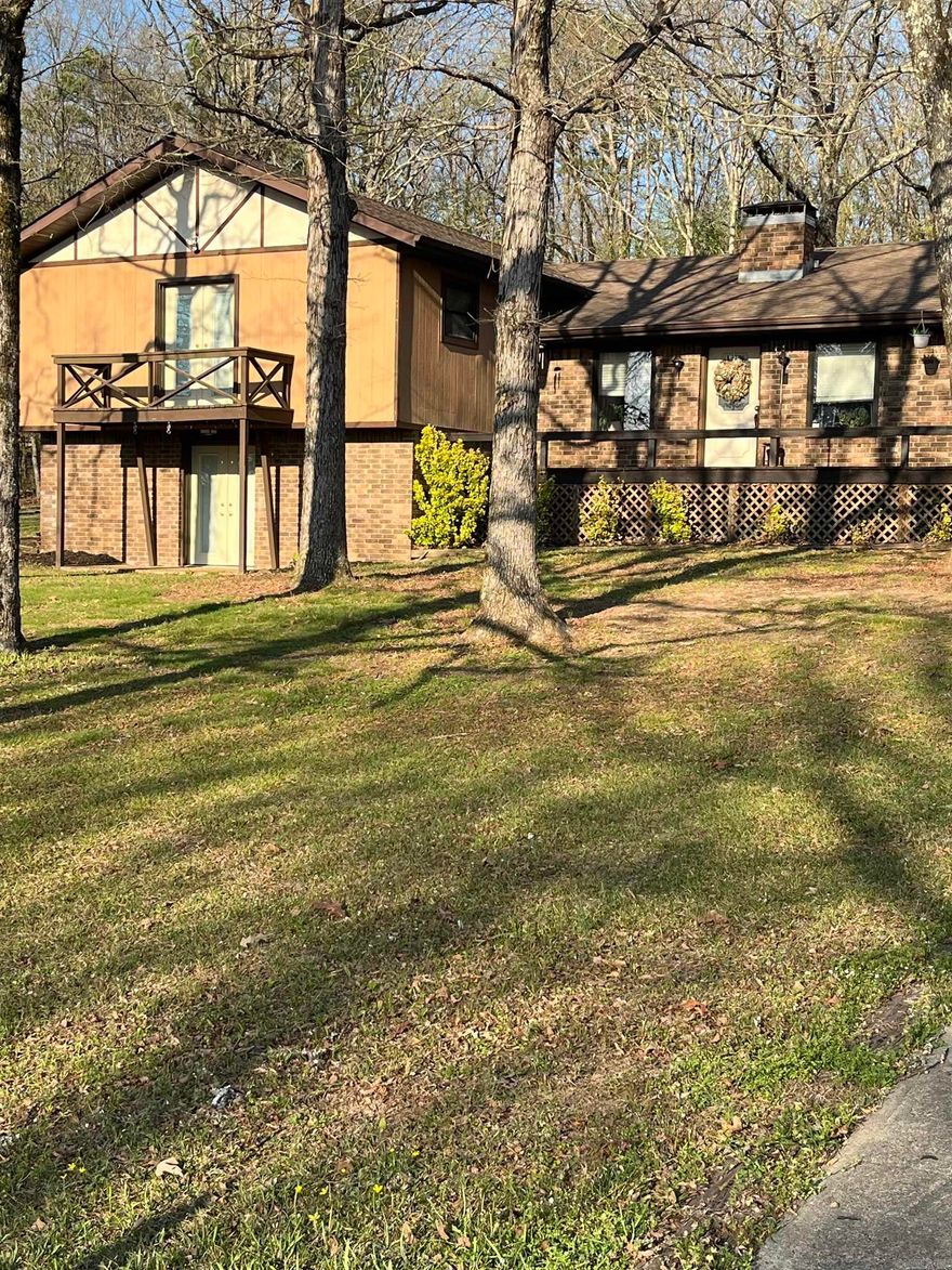 Enjoy privacy and space with this split-level home on just under 3 wooded acres in a quiet neighborhood near Greers Ferry Lake. Featuring 3 bedrooms, 2.5 baths, and a versatile bonus basement with ground-level walkout, this home offers flexible living options. Inside, you’ll find an inviting layout with a gas log fireplace, large living area and laundry room, and open-concept kitchen with breakfast bar and dining area. Ample storage is found throughout. Outside, the property includes a screened in back porch, garden area, partial chain-link fencing for pets, and plenty of room for outdoor activities. A  large heated shop building adds valuable workspace or storage. Additional highlights include ample parking for boats or RVs. Conveniently located just 1.9 miles from the Old Hwy 25 boat ramp, this property is ideal for full-time living or a lake getaway.  Roof has 25 year warranty which transfers to new owner.