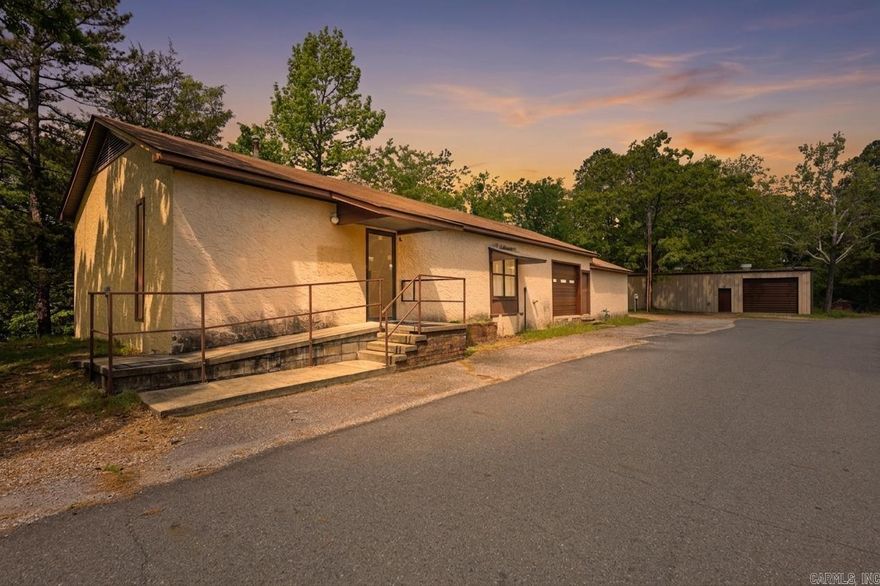 Versatile property in the heart of Mount Ida offering the opportunity to live, work, or invest—all in one location. Previously operated as a hair salon, this property is equipped with unique features including a tanning bed outlet, video surveillance system, and hookups for a stackable washer and dryer. The spacious garage provides excellent potential for storage, workshop use, or could be reimagined as additional living space.  Positioned near a major intersection with strong visibility and steady traffic flow, the location adds convenience and long-term value. Whether you're looking to convert it fully into a residence or maintain a live/work setup, this property offers flexibility to fit a variety of needs. Sellers have inactive real estate license. Agents see remarks