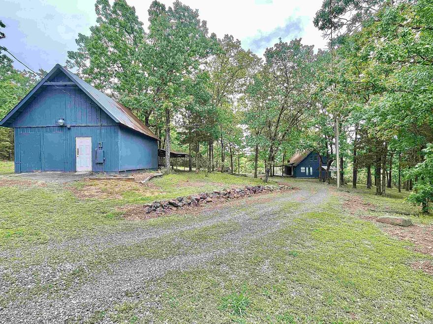 Adorable Cabin in the woods with plenty of privacy , sitting on approx. 4 acres +/-.  Location is amazing being a short golf cart/SXS ride away from Lacey's Marina (only 1.4 miles from the property). Main floor has one bedroom, one full bath, laundry room (washer & dryer stay), living room & Kitchen with all appliances staying (Seller is willing to negotiate some furniture items to stay).  2nd floor has two bedrooms & one full bath. There is a cozy covered Front porch, storm shelter, & a 20x30 detached garage for your lake toys/hunting gear!  There are pretty mountain views in the winter & fall.