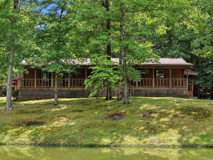 Experience country living at its finest with this charming 3-bedroom, 2-bathroom home, offering approximately 1,800 sq ft on 3.61 beautiful acres. Enjoy the convenience of Saline River access with a boat ramp located less than 2 minutes away, perfect for fishing, kayaking, or spending the day on the water. This property is perfect for those who love the outdoors and need space to spread out. Inside, you’ll find a spacious living area with a cozy wood-burning stove, a large pantry, and a primary bedroom with an en-suite bathroom. The sunroom provides the perfect spot to relax and enjoy peaceful views of the property year-round. Step outside to enjoy the long, spacious front porch, ideal for morning coffee or evening sunsets. The property also features a pond, garden space, fish cleaning station, and plenty of room for outdoor hobbies. Additional highlights include a workshop with lean-to, outdoor storage, and a durable metal roof. Enjoy peaceful country living; this property offers it all. Additional 40x80 Shop & 1.56 Land for Sale, address 4311 Peeler Bend MLS #26019697