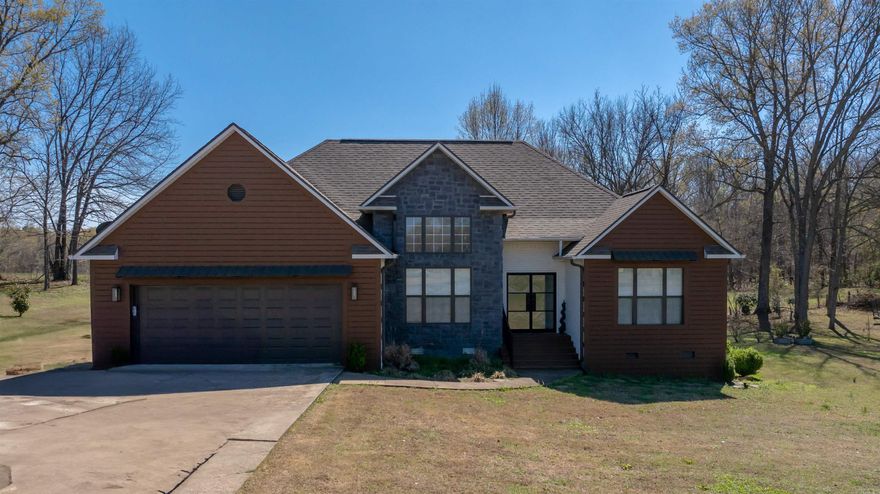 Tired of feeling cramped or too close to neighbors? This 4 bed, 2 bath home sits on over half an acre & gives you the space most buyers are looking for-but cant find.  With over 2000SQFT, this home features a split floor plan, hardwood flooring, & a large living area with tray ceilings & a gas fireplace that anchors the space.   The primary suite is positioned for privacy & includes a walk-in closet and double vanity.  A newer roof (2022) adds peace of mind, while the lot gives you room to breathe-inside and out.   The spacious deck offers room for entertaining, covered area for grilling and plenty of room to enjoy the sun.   If you've been searching for more room without sacrificing convenience to town, this one deserves a look!