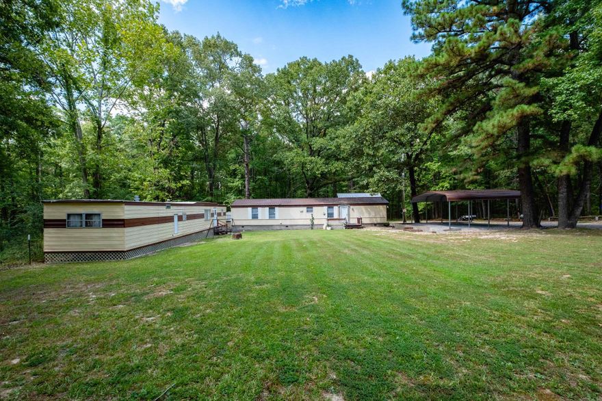Come see this secluded property that is on a level 1-acre lot. This unique property offers not one, but two mobile homes. 2nd mobile home is approximately 980 square feet and not included in square footage.  This property also comes with a two-car awning (installed in 2024), a shop with electricity and a storm shelter (installed in 2024). On the main mobile home, a new roof was installed in 2023 and underpinning was installed in 2023 as well.  The 1-acre lot provides ample space for outdoor activities, gardening, or even adding additional structures. Country living with the convenience of nearby amenities. Don't miss your chance to own this versatile and inviting property!  Agents, please see remarks.