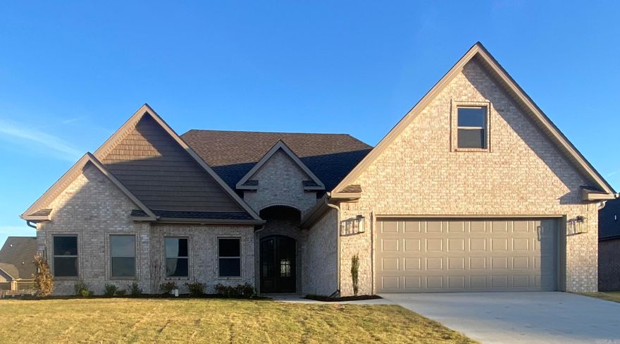 Experience luxury and comfort in this stunning 5-bedroom, 3-bathroom home built by Mark Morris Construction. Located in the sought-after Lake Pointe Subdivision, this home features an open floor plan perfect for both family living and entertaining. The kitchen is a chef's delight, boasting a gas range cooktop, built-in electric oven and microwave, a large island, and a walk-in pantry.    Enjoy cozy evenings by the gas log fireplace in the living area or take the party outside to the screened-in back porch and concrete grilling pad perfect for outdoor gatherings. The grand double front doors welcome you into a space where attention to detail shines, from the wood closet shelving to the foam insulation that ensures energy efficiency and comfort year-round.    With a tankless gas water heater providing endless hot water, this home is as practical as it is beautiful. Discover the perfect blend of style and function in this exquisite new construction.