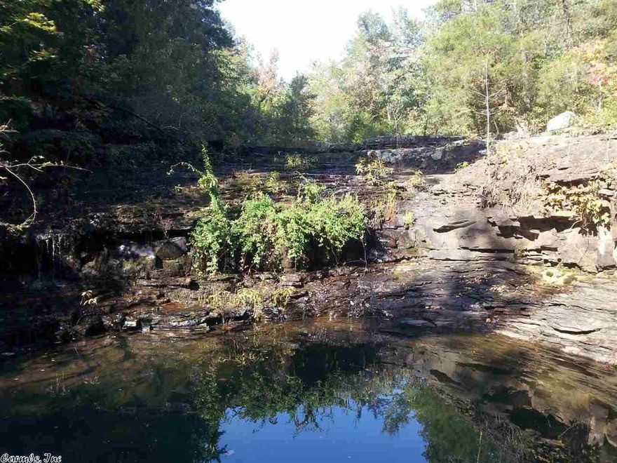 Just an outstanding wildlife property that has the right combination of fields, hardwood, running water and ponds.Also see MOPLS# 15224 for an additional 80acres of White Oak trees make up the bulk of the mast producing trees along ridges and draws...plenty of good bedding area for the deer and roosting places for the turkey. The property is fenced and ready for some cattle or cut the hay in the fields...Dog lick creek runs through the property with an old swim hole and underwater cave.