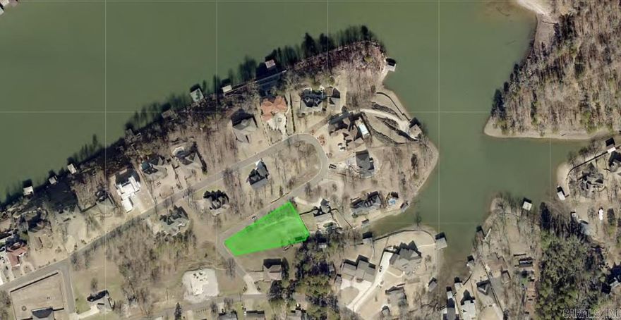 Lake front lot at the end of a cove, its beautiful gently sloping lot to the lake.  2,200 minimum sq ft home. Owner is Agent.  Also have a modern plan design that fits in the property and can go with the sale.
