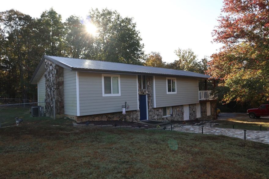 COUNTRY STYLE HOME LOCATED IN SALEM ARKANSAS  Property is located at 361 N Cedar St, Salem, AR. This 4 bedroom, 2 1/2 bath home has approx. 2,100 sq. ft. of living area. Approx.1,226 sq. ft on main level and approx. 897 sq. ft. of living area in the basement. It has central heat and air, gas fireplace, range and dishwasher. It include a large living room, family room down stairs and large covered deck on the main level. The home has had several updates in the past few years and is move in ready. 2 car parking carport, chain link fenced in back yard and 2 storage buildings. Beautiful landscaped yard with several shade trees. Also a 500 gallon propane tank. Nice quite neighborhood. Last year real estate taxes were $981.33.