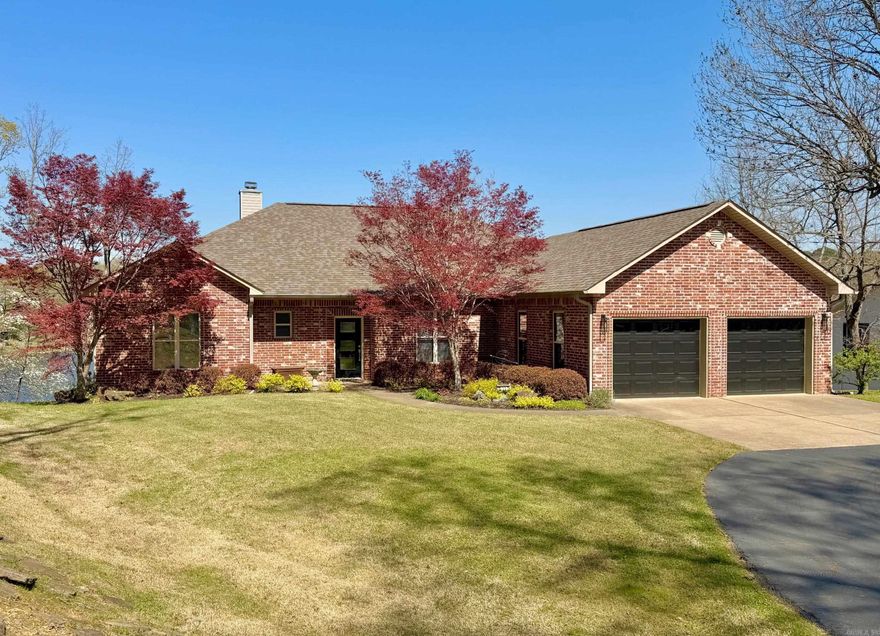 Very well maintained waterfront home on Lake Hamilton! This custom built, one-owner residence sits on a large 3/4 acre lot with year-round water and stunning views of the lake and surrounding mountains. The main level features 3 bedrooms and 2.5 baths, highlighted by custom hardwood floors and a cozy fireplace. The lower level is designed for entertaining, offering a spacious recreation area with bar, half bath and a dedicated woodworking shop. Additional features include an integrated geothermal system, whole-home generator, lifetime-guarantee water heater, sprinkler system and single stall boat dock with lift. Convenient in-town location puts you close to shopping, dining, and entertainment while enjoying the tranquility of lakefront living.