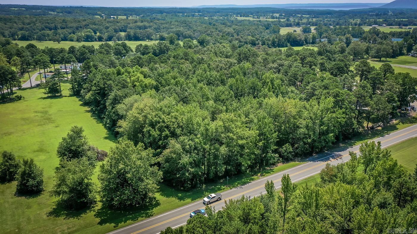 3.52 acres of prime land, this property is ideally situated on the Highway in the heart of town. With its proximity to Sonic & high traffic flow, this parcel offers unlimited potential for both commercial & residential use.Perfectly positioned next to Sonic, this wooded land enjoys high visibility & exposure, making it an ideal location for a business venture. Entrepreneurs & investors will appreciate the unrestricted zoning, allowing for a wide range of commercial possibilities. Whether you envision a restaurant, retail store, or office space, this property provides the canvas to bring your dreams to life.For those seeking a residential haven, this parcel offers the perfect opportunity to build your dream home. The lush, wooded surroundings provide a serene & private atmosphere, creating an oasis of tranquility amidst the bustling town.Greers Ferry Lake is just a short distance away. With its crystal-clear waters &, breathtaking scenery the lake offers an array of recreational activities.Greers Ferry is a charming community known for its warm hospitality, friendly locals, & a strong sense of community. The town boasts a variety of amenities, all within reach of this beautiful land
