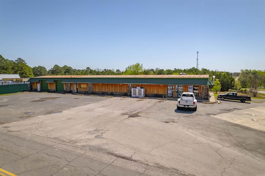 Commercial Building and Land suitable for many potential income producing opportunities! Currently the home of Beaver Liquors (Biz Not For Sale), this space is ready for a new vision to be brought to life! Whatever your business is, this space can suit it! In a past life it was a convenience store & offered units to lease as retail spaces. The inground tanks, pumps, & canopy (replaced in 2020) are still there to bring that vision back to life in an area w/limited competition & at the 4-way stop intersection of Hwy 330 S & Beaver Road. The tanks are ACT 100 tanks w/ 2 having an 8,000 gallon capacity & 3rd is 6,000 gallons. The convenience store also served food & the suppresser system remains, making the suitability for a restaurant there as well! The 30 ft X 8 ft walk in cooler with 11 customer facing glass doors makes either one of those visions very attainable! The building offers over 4,200  Sq feet of heated & cooled space w/(3) 5-ton commercial HVAC units (installed in 2022). Plus an additional 1,760 sq feet of warehouse space. With this location being ONLY 4 MINUTES (approx 1 mile) to Marina. Cameras convey. Possible storage area too. NOTE: SCHEDULE SHOWING W/LISTING AGENT