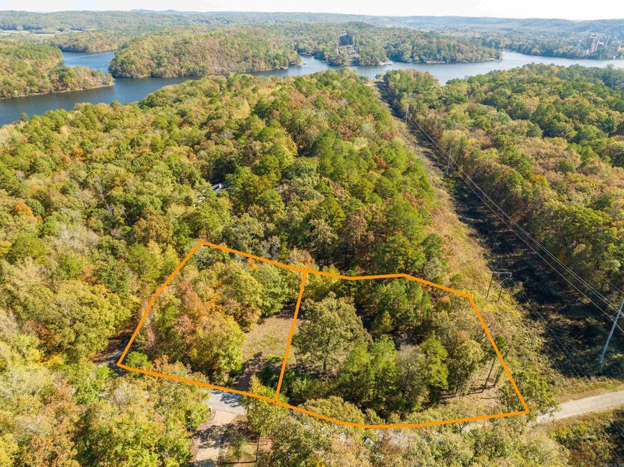 Envision, design and build your perfect home on these three adjoining level lots totaling 1.5 acres in the gated Diamondhead community.  Located at the corner of Independence and Battery with the southern boundary abutting a powerline easement for enhanced privacy.  Residents of the community enjoy a host of amenities including lake access points for boat launching, an Olympic-size swimming pool, 18 hole PGA sanctioned golf course, tennis/pickleball courts, playground and picnic area.  The clubhouse and banquet room offer additional spaces for social gatherings and events. Diamondhead is located just one mile from beautiful Lake Catherine State Park.  Shape your dream on this blank canvas of opportunity!