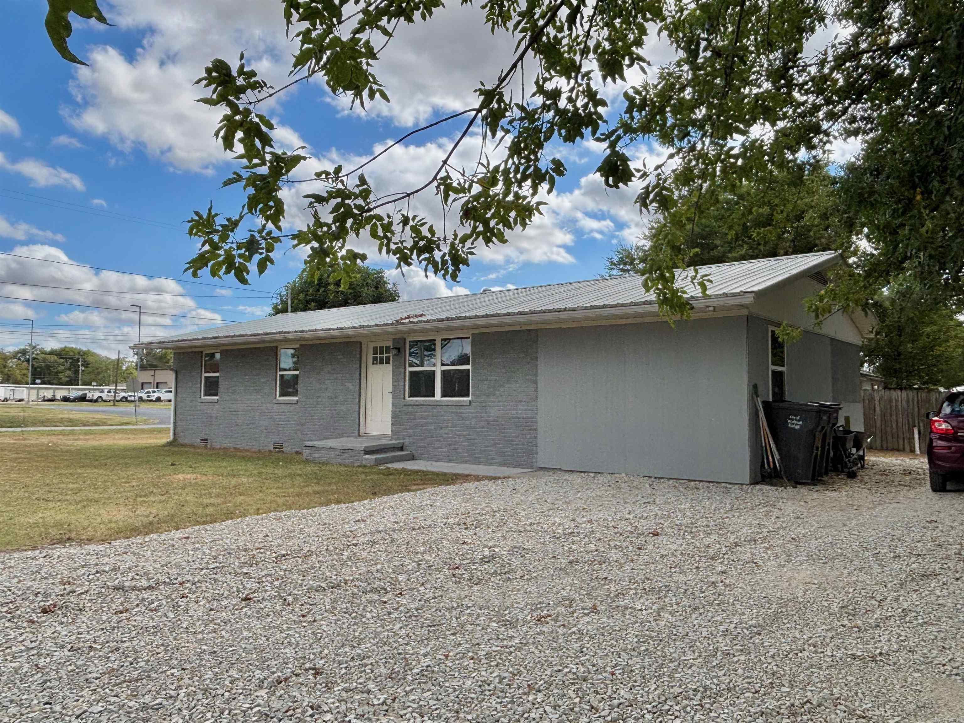 Completely remodeled 4-bedroom, 2-bath brick home on a corner lot in the heart of Walnut Ridge! This 1,350 sq ft home features beautiful butcher block countertops, neutral tones throughout, and quality finishes that give it a fresh, modern feel. The layout is functional and inviting, with spacious bedrooms and updated baths. A durable metal roof adds long-term value and peace of mind. Located just minutes from the hospital, schools, stores, and restaurants, this home offers both comfort and convenience. Perfect as a family home or investment property—move-in ready and full of charm!