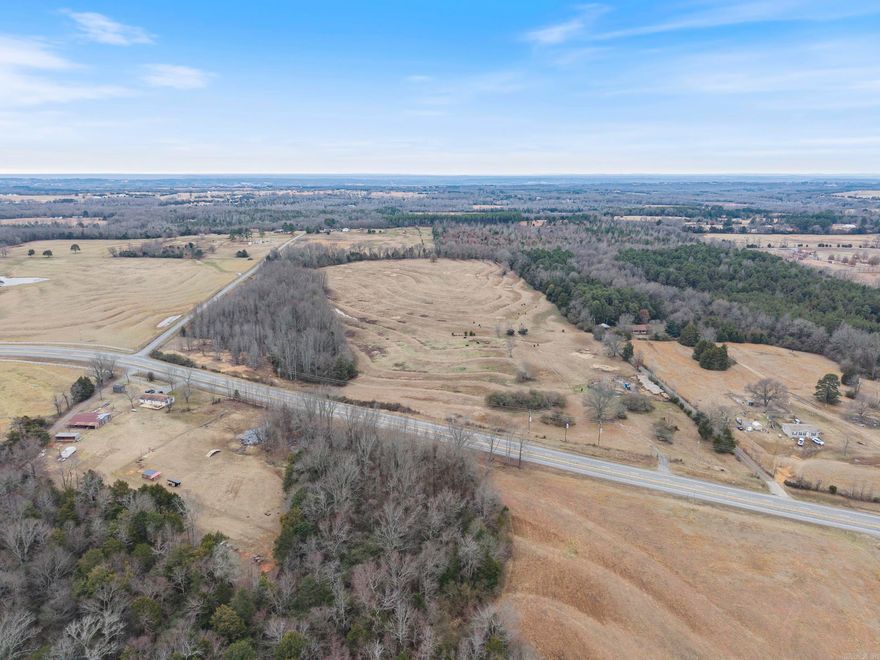 Prime Land Opportunity! Discover an incredible piece of land with highway frontage on Hwy 25, offering exceptional visibility and access in the heart of Guy! This property sits only one parcel down from the Guy-Perkins Schools and is fully fenced for livestock. This property boasts a rich history as an old homestead, with a storm cellar and a water well likely still on-site. Utilities are available at the road - this land presents endless possibilities—whether you envision a thriving commercial development, a high-traffic retail space, or a charming residential subdivision. Its high traffic count to the lake makes it an ideal investment for future growth. Mineral rights convey! Don’t miss this rare opportunity to own a versatile and highly desirable piece of real estate in a prime location! Call your favorite agent today for more details.  Agents, see remarks.