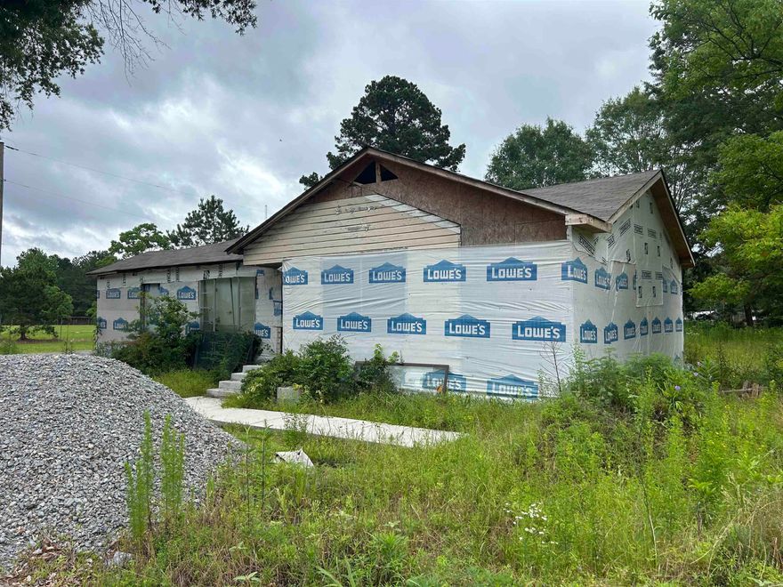 This three bedroom, two bath presents the perfect opportunity for an investor to fix up and flip! The roof is brand new and some of the plumbing and electrical has been updated. All building materials on site will convey with the purchase. HUGE corner lot.