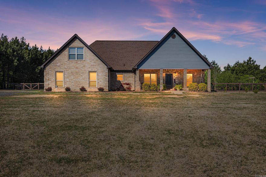 Welcome to your private retreat-where space, style & comfort come together beautifully! Situated on 4 sprawling acres, this stunning 4 bedroom home offers the perfect blend of elegance & functionality. From the moment you arrive, the inviting front porch & eye catching decorative iron door set the tone for what's inside. Step into a designed open layout featuring  wood look tile throughout the main living areas, combing durability w/modern charm. The formal dining room flows seamlessly into a spacious kitchen complete with granite countertops,stainless steel appliances, a large island & prep sink. The main level offers well-appointed bedrooms & two full baths, while upstairs you'll find a versatile bonus roomful bath and 4th bedroom or office. Ideal for guests, a home office or a private retreat. Out back, your personal oasis awaits. Enjoy an enormous saltwater pool w/a tanning ledge and built in sprinklers, creating the ultimate outdoor experience. The expansive backyard offers endless opportunities for relaxation, entertaining & making memories. Additional features include an oversized garage & plenty of room to spread out both inside and outside.