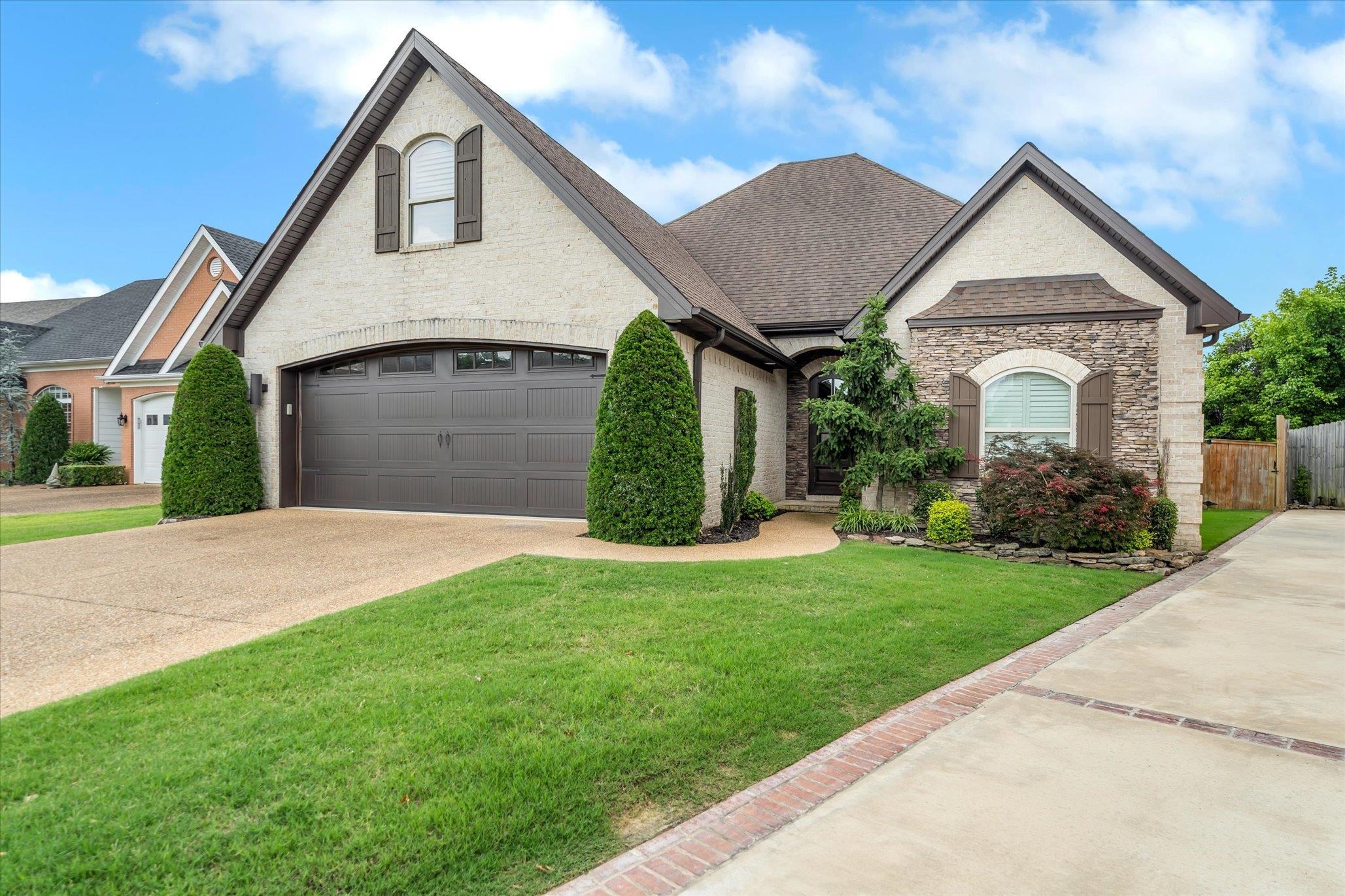 BEAUTIFUL, high end designer style in desirable Windover Garden Circle. This 3 bedroom (2 on main level), & 3 bath (2 on main level) is a one of the most beautiful homes you'll see in Jonesboro! Absolutely breathtaking with hardwood flooring, vaulted ceilings, wooden beams, a chef's dream kitchen with large island, brick accent wall & wooden insets in dining room, and sunroom that is perfect for morning coffee time overlooking the fully fenced backyard! This is a very special home built with attention to detail!