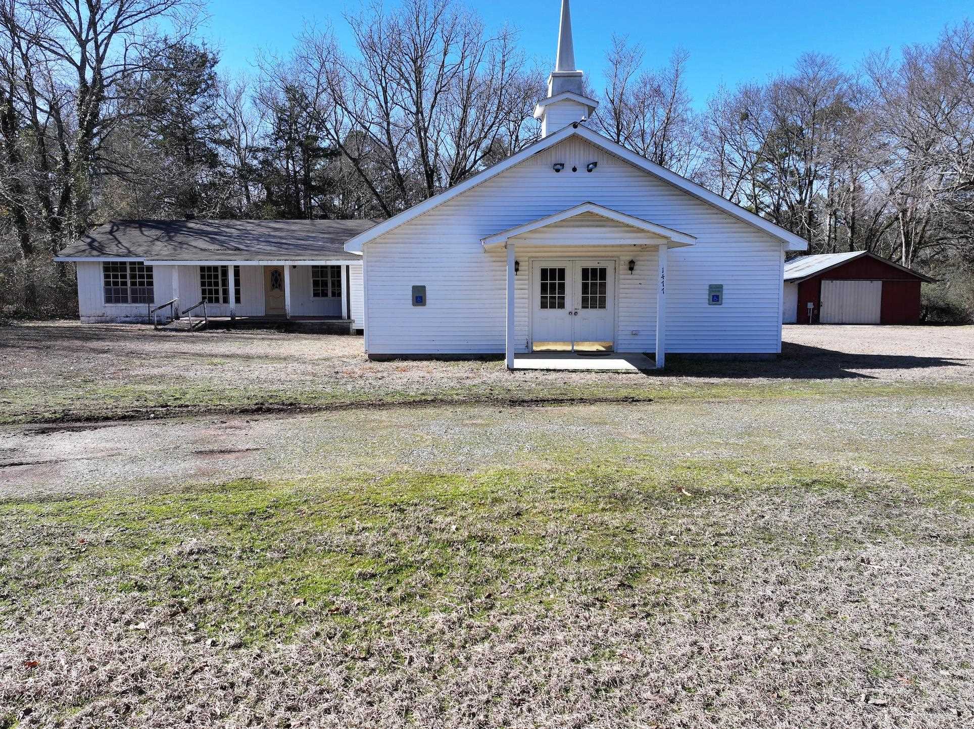 Located at 1477 Hwy 298 South, Sims, AR, this property is situated on 1± acres and offers a unique opportunity for a variety of uses, just moments from the Ouachita River. The 1,200 sq ft parsonage includes a kitchen, classroom space, and 2 restrooms. Additional features include a 9x9 office, 9x5 storage, and 2 HVAC units for year-round comfort. Perfect for those looking to create a space that fits their needs.
