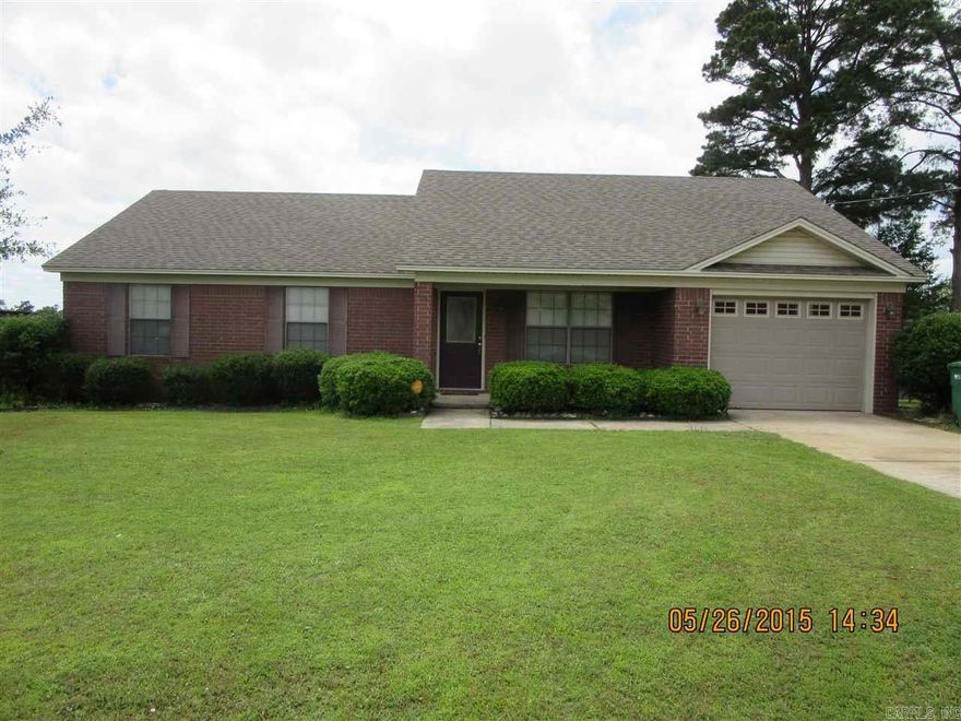 Come see this beautiful home today! This home features vaulted ceiling in living room, tray ceiling in master. Large rooms throughout, crown moldings, extra parking pad, storage building/shop, covered front porch and back patio, as well as giant back yard. The only thing missing is your family! Washer, dryer, refrigerator stay with acceptable offer. Brand new dishwasher.