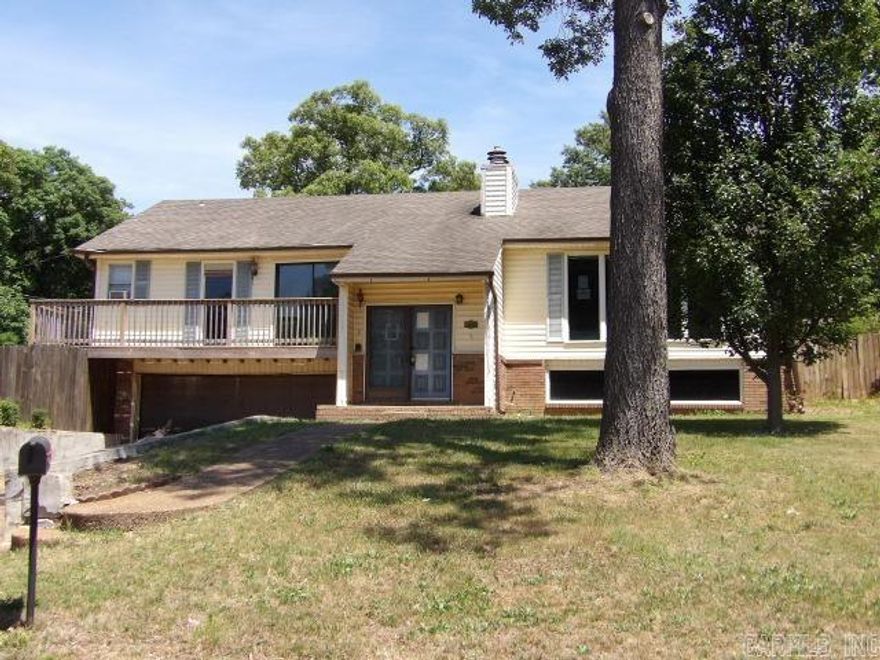 This multi-level home offers a rare opportunity to secure a property just moments from the Jonesboro Country Club. The location alone delivers exceptional long-term value, mature trees, and the convenience of being close to premier golf, dining, and social amenities. Inside, the home features a versatile multi-level layout, including a basement that expands your options for additional living space, recreation, storage, or a future guest suite. Large windows bring in natural light, and the existing footprint provides for a thoughtful renovation. This property is ideal for buyers who recognize the power of location and the return potential that comes with updating a home in a high-demand neighborhood. Whether you're planning a full modern refresh or a strategic cosmetic upgrade, the upside is undeniable. With its superb setting near the Country Club and a layout ready for transformation, this home is a smart investment for anyone looking to build equity in one of Jonesboro's most established and sought-after areas. ** Agents see remarks and download the form for entry first.