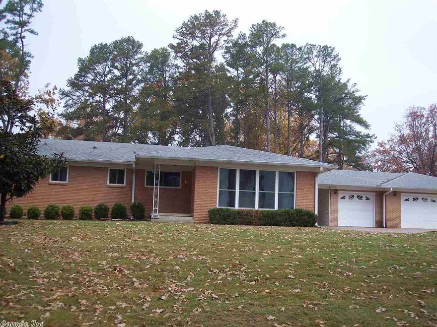 SELLER IS MOTIVATED...Large home for entertaining your family on 4.04 acres in town. This one owner home has lots to offer both inside and out.  Open kitchen to a den area. 3 Bedrms upstairs and 1 bedrm and bath, laundry, bonus rm downstairs that has doors that open outside.  Newer windows are a plus and a 3 car garage with a half bath in it.  Spacious patio at back of house gives privacy for the hot tub that conveys.  Home sits on a hill that gives you great views to enjoy.  Lots of built-ins/storage.